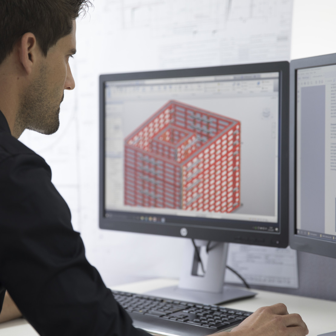 Image of man designing high rise building using BIM formwork design