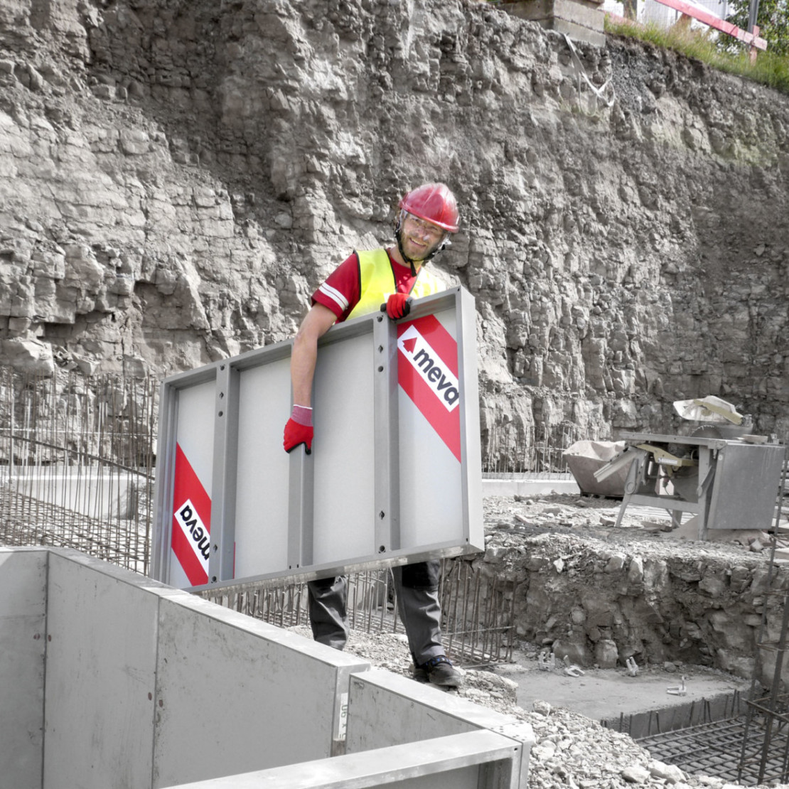 Worker carrying a lighweight formwork