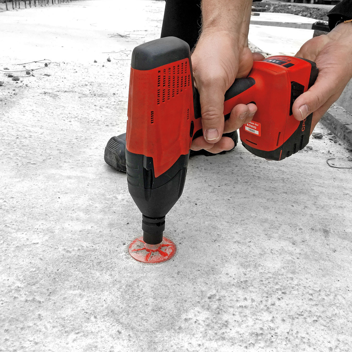 Image of person drilling into concrete