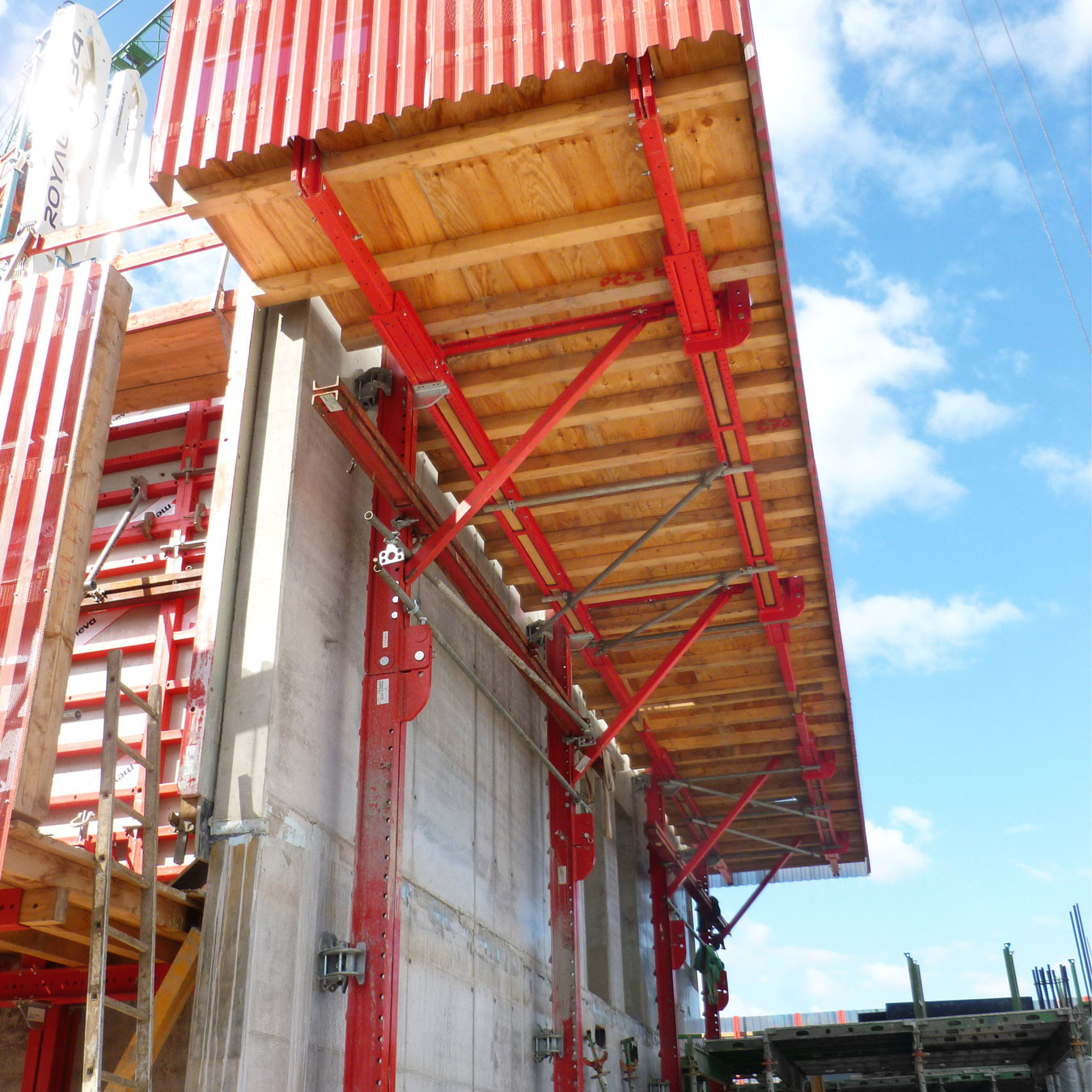 A rail guided formwork system attached to a concrete wall under construction