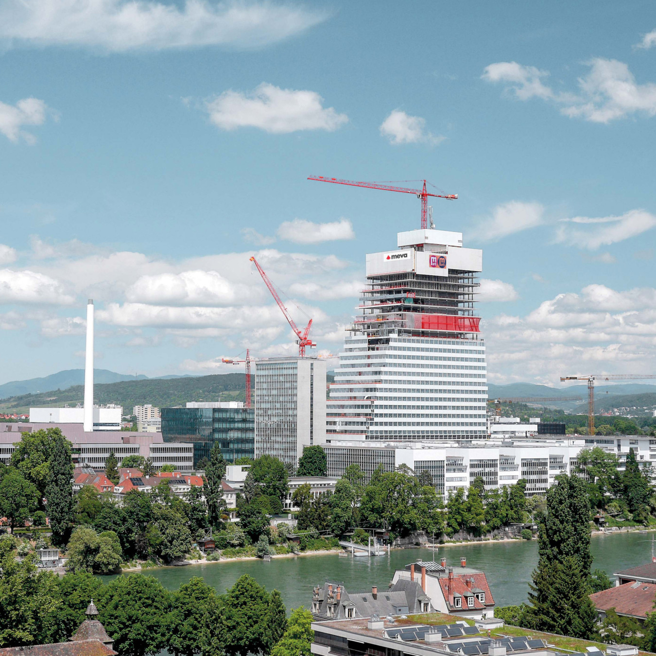 A high rise building with cranes and climbing formwork