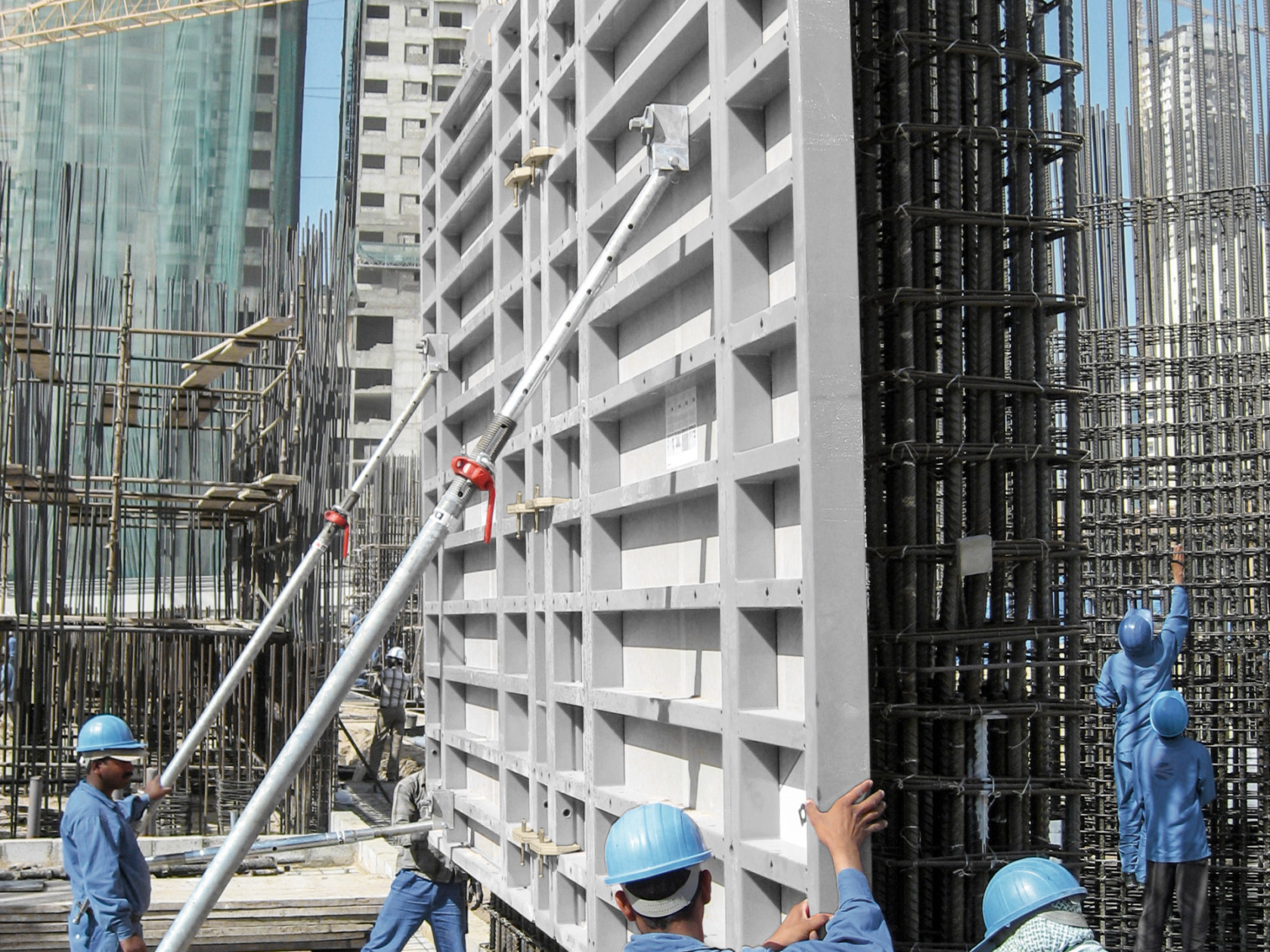 Crane assisted setup of wall formwork with steelwork